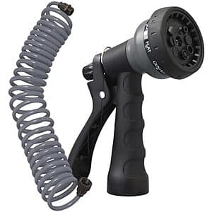 Coiled gray garden hose 25 feet long with attached 8-pattern spray nozzle.
