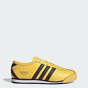 Adidas Women Italia 70s retro sneakers with spring yellow, dark brown, and core black colorway, displaying lace closure and leather/suede upper construction.