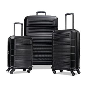 American Tourister Stratum 2.0 hardside expandable luggage set with three suitcases in neutral color.
