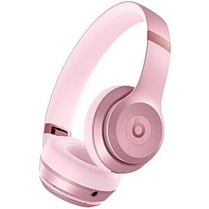 Beats Solo 4 wireless on-ear headphones in metallic pink with Bluetooth connectivity.