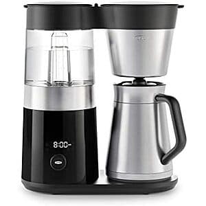 OXO Brew 9-cup stainless steel coffee maker with glass carafe and black accents.