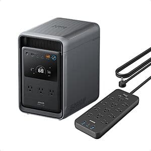 Anker Solix S2000 portable power station with grey casing and integrated power strip, featuring digital display panel and multiple outlet ports.