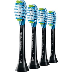 Set of four black Philips Sonicare Premium Plaque Control brush heads in original packaging.