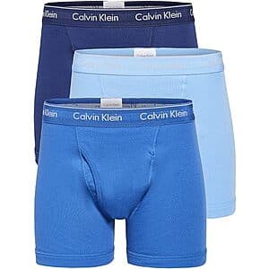 Three-pack of Calvin Klein men's classic boxer briefs in white and various blue colorways displayed flat.