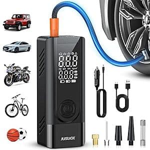 JUSUOX portable tire inflator with digital display, featuring black casing, dual power inputs (cordless battery dock and 12V DC cable), and multiple nozzle attachments included.