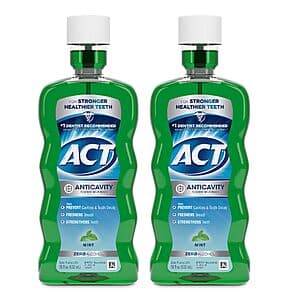 Two 18-ounce bottles of ACT Anticavity Fluoride Mouthwash in mint flavor with blue-green packaging.