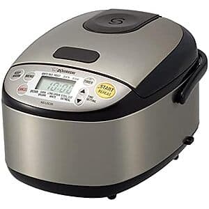 Zojirushi white and stainless steel 3-cup micom rice cooker with lid, control panel, and keep-warm function display.