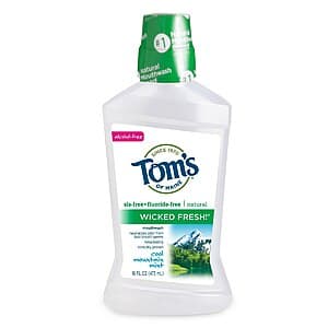 Assortment of oral care products including toothpaste tubes, mouthwash bottles, and floss picks on a white background.