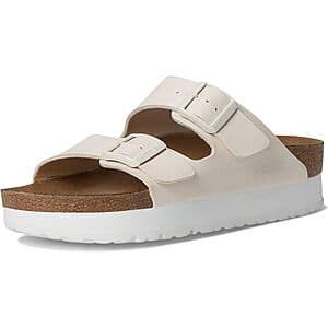 Birkenstock Women's Arizona Platform Sandals in eggshell color with signature footbed and buckle closure.