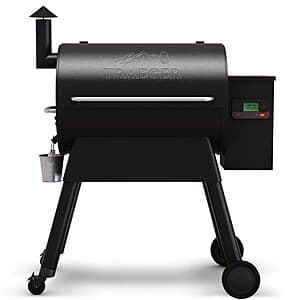 Traeger Pro 780 wood pellet grill with black finish and 780 square inches of cooking area, showing the main grilling surface and digital control interface.