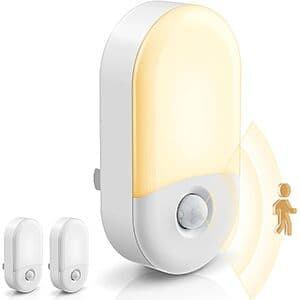 Two white LOHAS LED dimmable motion sensor plug-in night lights with 3000K soft white glow, suitable for nighttime illumination.