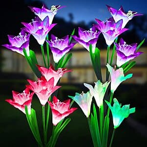 Four KOOPER solar-powered lily-shaped garden lights with LED bulbs in various colors, designed for outdoor garden placement.