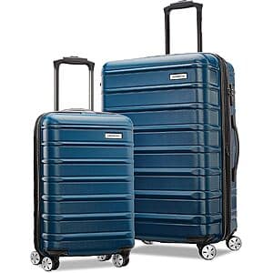 Two Samsonite Omni 2 hardside spinner suitcases—one medium and one carry-on—with multi-directional wheels and ergonomic handles.