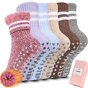 Six pairs of colorful fuzzy slipper socks with non-slip grips on the soles, sized for children ages 6 to 12 years in various colors.