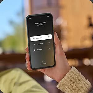 Fairphone Gen. 6+ smartphone in black with visible modular design, featuring replaceable components and a physical side switch for Moments mode.