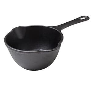 Dark seasoned Victoria cast iron saucepan with 0.5-quart capacity and dual pour spouts.