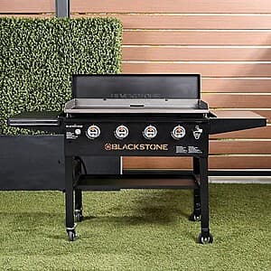 Blackstone 2472 36-inch omnivore griddle with flat cooking surface and metal frame.