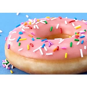 Assorted Krispy Kreme doughnuts including Original Glazed, chocolate-filled, and sprinkled varieties on a white background.