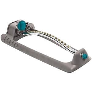 Gilmour adjustable rectangular lawn sprinkler in black and gray plastic with adjustment knobs for water pattern control.