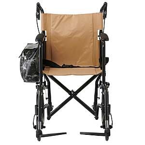 Medline transport wheelchair with removable side bag in dark blue or gray upholstery, showing fold-down design and wheels.