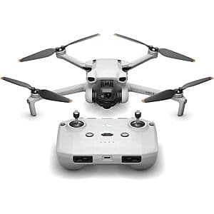 DJI Mini 3 compact camera drone showing silver body with folded propeller arms, 3-axis gimbal, and integrated camera lens.