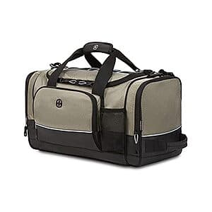 SwissGear Apex duffel bag in dark polyester with reinforced handles, front organizer pocket, side mesh water bottle pocket, and bungee-cord storage system on top.
