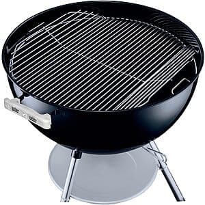 Heavy-duty plated steel hinged cooking grate with flip-up sides and raised handles, designed for 22-inch Weber kettle charcoal grills.