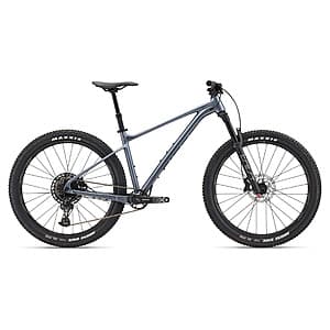 Giant Fathom 1 hardtail mountain bike in Knight Shield color with aluminum frame, front suspension fork, and high-volume tires.