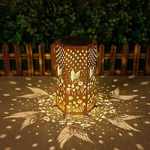 Copper-tone metal solar hanging lantern with decorative hummingbird cutout design.