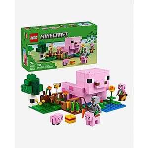 238-piece LEGO Minecraft The Baby Pig House set with pink pig minifigure and brown wooden construction pieces.