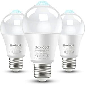 Three Boxlood 12W LED light bulbs with built-in motion sensor and dusk to dawn technology, standard bulb shape in white packaging.