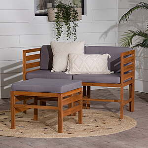 Two brown and grey acacia wood modular outdoor chairs with matching ottoman, featuring removable cushion covers.