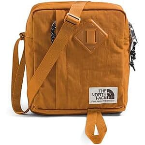 The North Face Berkeley 4.75L Crossbody Bag in Timber Tan with adjustable strap and front pocket.