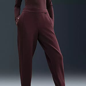 Nike Women's 24.7 ImpossiblySoft Mid-Rise Jogger Pants in Burgundy Crush colorway.