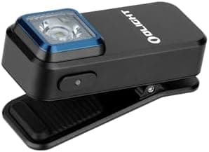 Black Olight Oclip rechargeable flashlight with compact design, shown as a keychain-sized EDC light.
