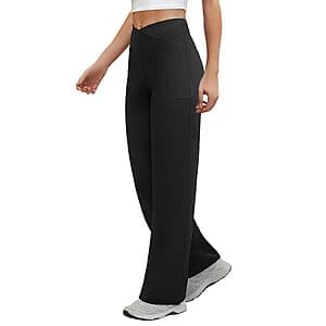 COPYLEAF women's crossover waist wide leg yoga lounge pants in black, shown flat lay with visible 2 front pockets.
