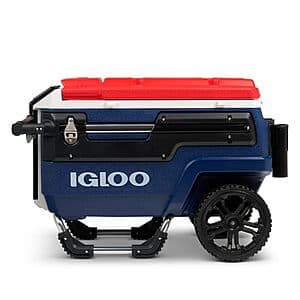 Igloo Trailmate Journey 70Qt wheeled cooler in white with blue accents, featuring 10-inch wheels and telescoping handle, shown as a three-quarter view.