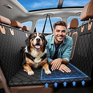 Hard honeycomb-textured black back seat extender pad for dogs displayed in an SUV back seat environment.