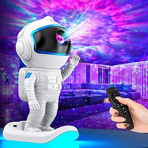 Blue astronaut-shaped LED night light galaxy projector with nebula and star light effects for bedroom ambiance.