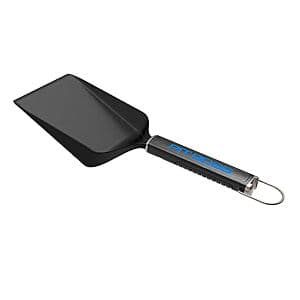 Pit Boss Ultimate Griddle Grub Shovel with wide metal blade and integrated bottle opener on handle.
