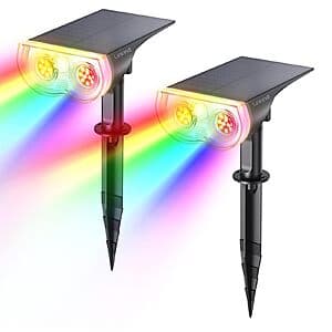 Two Linkind Starray RGB solar LED landscape spotlights with adjustable heads, featuring black bodies and multicolor LED capability for outdoor garden use.