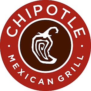 White Chipotle container of chips and fresh green guacamole with avocado visible.