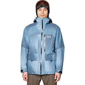 Blue insulated Mountain Hardwear Firefall jacket with quilted panels and secure pocket design.