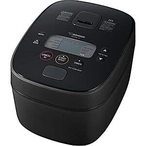 Zojirushi NW-QAC10 stainless steel induction rice cooker with digital control panel and 5.5-cup capacity.