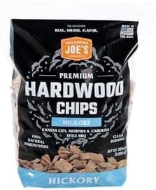 Oklahoma Joe's Hickory Wood Chips in a 192 cubic inch bag, packaged in brown kraft paper with product branding visible.