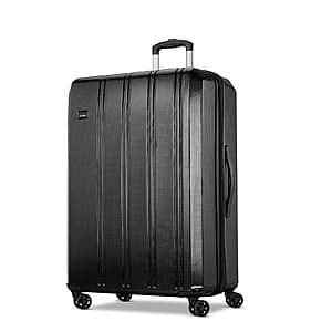 Samsonite 31-inch hardside spinner luggage in blue or black with four spinner wheels and ergonomic handle.