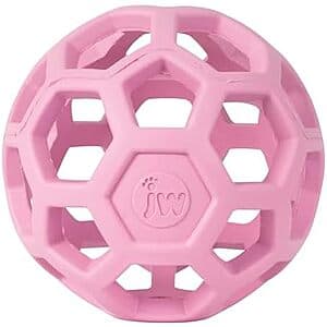 3-inch blue and pink rubber HOL-ee Roller puzzle ball dog toy with hollow treat-dispensing design for interactive play.