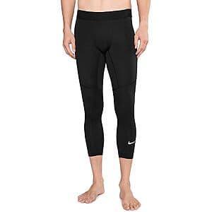Black and white Nike Men's Pro Dri-FIT 3/4-Length Fitness Leggings folded flat or on display.