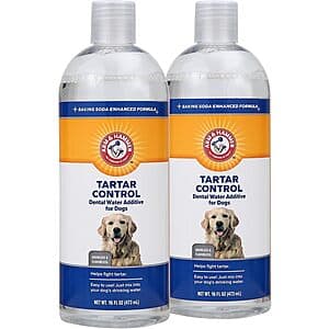 Two 16-ounce bottles of Arm & Hammer Clinical Care Dental Rinse in blue packaging for adult dogs.