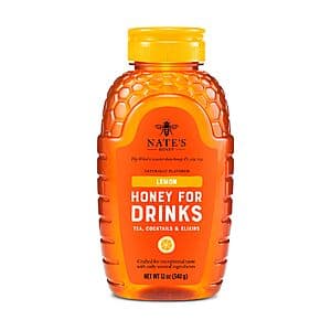 Nate's 12-ounce yellow lemon honey squeeze bottle with flip-top cap.